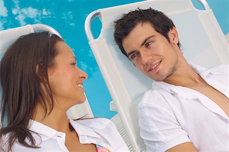 simsearch:600-01041609,k - Couple Lounging Poolside Stock Photo - Premium Royalty-Free, Code: 600-01041695