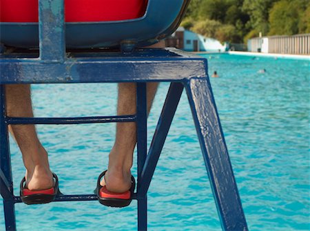 Lifeguard Watching Swimming Pool Stock Photo - Premium Royalty-Free, Code: 600-01041703