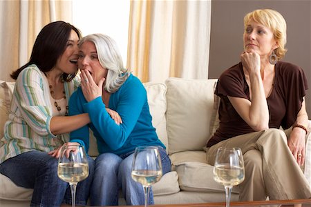 Friends Gossiping on Sofa Stock Photo - Premium Royalty-Free, Code: 600-01041801