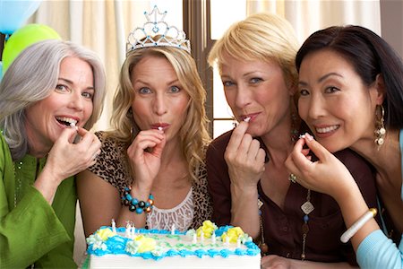 simsearch:600-02671208,k - Women Tasting Birthday Cake Stock Photo - Premium Royalty-Free, Code: 600-01041815
