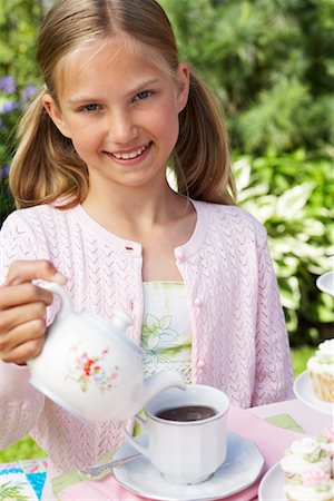 simsearch:700-05786455,k - Girl Pouring Tea at Tea Party Stock Photo - Premium Royalty-Free, Code: 600-01041946