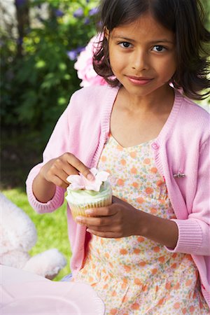 Girl Holding Cupcake Stock Photo - Premium Royalty-Free, Code: 600-01041943
