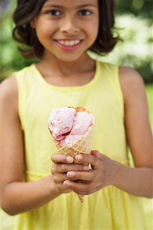 Girl Holding Ice Cream Cone Stock Photo - Premium Royalty-Free, Code: 600-01041977