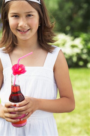 Girl Holding Bottle of Soda Pop Stock Photo - Premium Royalty-Free, Code: 600-01041980
