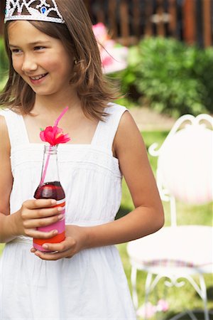 Girl Holding Bottle of Soda Pop Stock Photo - Premium Royalty-Free, Code: 600-01041982