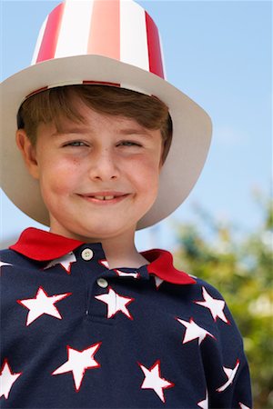 simsearch:600-00847925,k - Portrait of Boy Wearing Stars and Stripes Top and Hat Stock Photo - Premium Royalty-Free, Code: 600-01041993