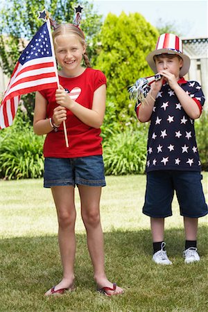 simsearch:700-00092986,k - Portrait of Girl Holding American Flag with Boy Wearing Stars and Stripes Top and Hat Stock Photo - Premium Royalty-Free, Code: 600-01042007