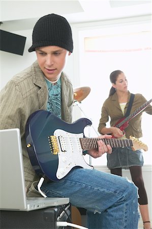 simsearch:600-01072271,k - Rock Band Practicing with Laptop Computer Stock Photo - Premium Royalty-Free, Code: 600-01072226