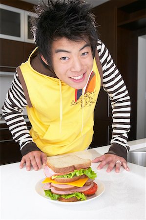 simsearch:600-01072271,k - Boy with Sandwich Stock Photo - Premium Royalty-Free, Code: 600-01072258