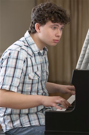 Boy Playing Piano Stock Photo - Premium Royalty-Free, Code: 600-01072274