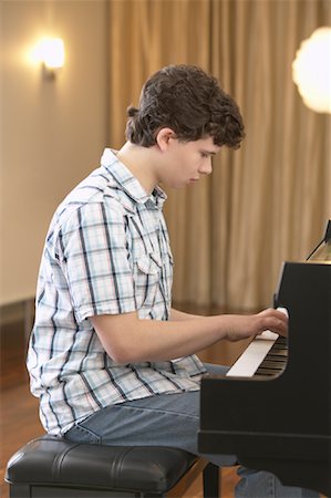 Boy Playing Piano Stock Photo - Premium Royalty-Free, Code: 600-01072273