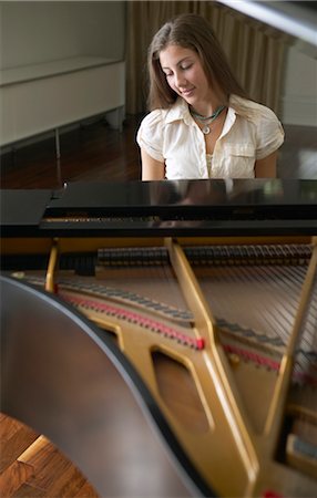 Woman Playing Piano Stock Photo - Premium Royalty-Free, Code: 600-01072288