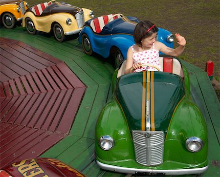 Girl Ridding in Austin Car Ride, Carters Steam Fair, England Stock Photo - Premium Royalty-Free, Code: 600-01072609
