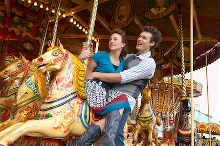 Couple on Merry-Go-Round, Carters Steam Fair, England Stock Photo - Premium Royalty-Free, Code: 600-01072615