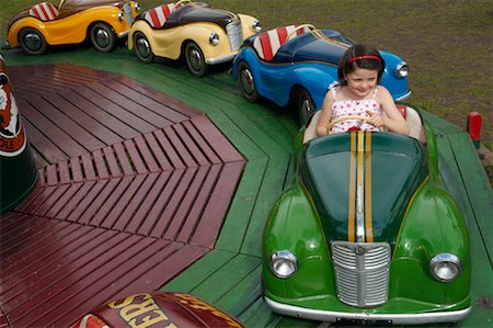 Girl Ridding in Austin Car Ride, Carters Steam Fair, England Stock Photo - Premium Royalty-Free, Code: 600-01072610