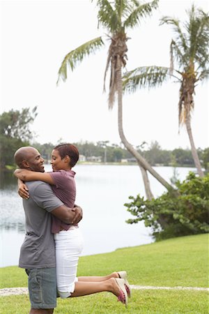 romantic lift hug - Couple Hugging Outdoors Stock Photo - Premium Royalty-Free, Code: 600-01072858