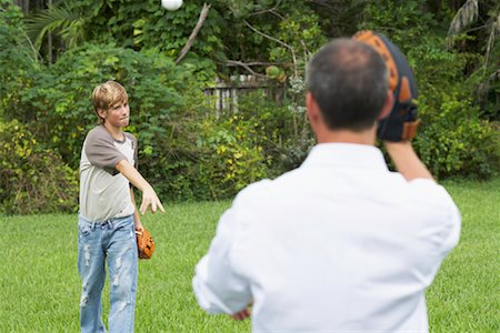 simsearch:600-01073545,k - Father and Son Playing Catch Stock Photo - Premium Royalty-Free, Code: 600-01072877