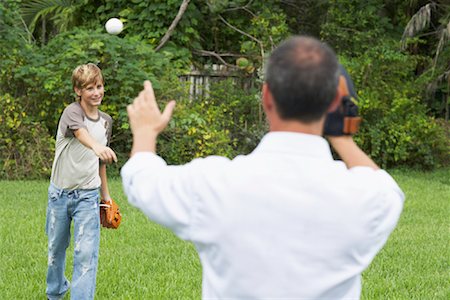 simsearch:600-01073545,k - Father and Son Playing Catch Stock Photo - Premium Royalty-Free, Code: 600-01072878