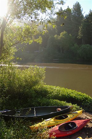 Canoes on Riverbank Stock Photo - Premium Royalty-Free, Code: 600-01072987