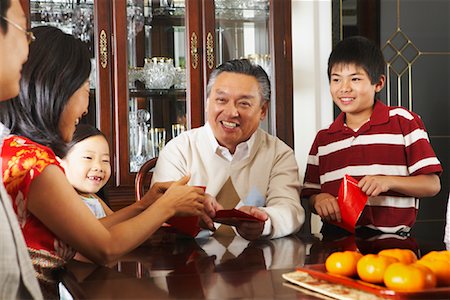 simsearch:700-00073572,k - Family in Dining Room Stock Photo - Premium Royalty-Free, Code: 600-01073110