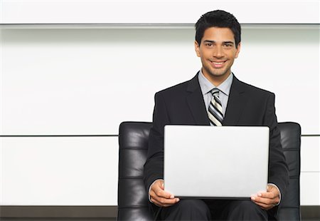 Portrait of Businessman with Laptop Computer Stock Photo - Premium Royalty-Free, Code: 600-01073193