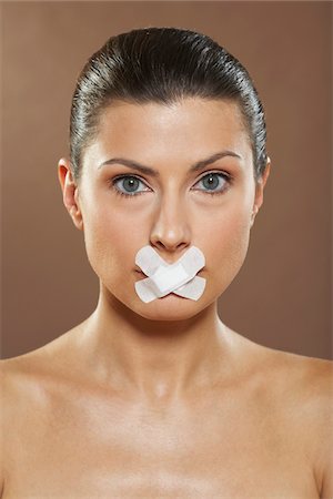 simsearch:700-01073337,k - Portrait of Woman with Bandage on Mouth Stock Photo - Premium Royalty-Free, Code: 600-01073374