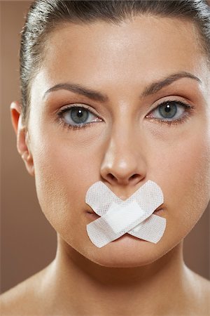 simsearch:700-01073337,k - Portrait of Woman with Bandage on Mouth Stock Photo - Premium Royalty-Free, Code: 600-01073375