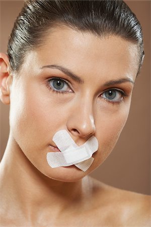 simsearch:700-01073337,k - Woman with Bandages over Mouth Stock Photo - Premium Royalty-Free, Code: 600-01073376