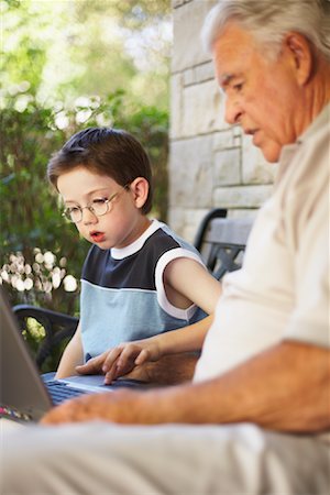 simsearch:600-01694154,k - Grandfather and Grandson Looking at Laptop Computer Stock Photo - Premium Royalty-Free, Code: 600-01073532