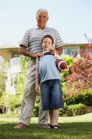 football in the backyard - Portrait of Grandfather with Grandson Stock Photo - Premium Royalty-Free, Code: 600-01073540