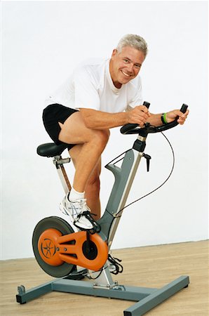 simsearch:600-01124353,k - Man Using Exercise Bike Stock Photo - Premium Royalty-Free, Code: 600-01083217