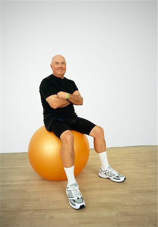 simsearch:600-01124355,k - Portrait of Man Sitting on Exercise Ball Stock Photo - Premium Royalty-Free, Code: 600-01083218