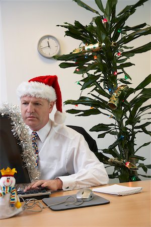 simsearch:700-01015007,k - Businessman in Office with Christmas Decorations Stock Photo - Premium Royalty-Free, Code: 600-01083289