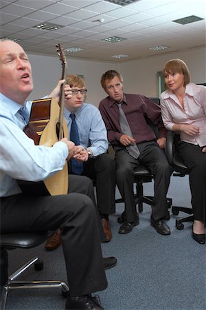 simsearch:700-01249265,k - Manager Playing Guitar for Employees Stock Photo - Premium Royalty-Free, Code: 600-01083309