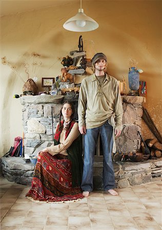 Hippie Couple in Front of Fireplace Stock Photo - Premium Royalty-Free, Code: 600-01083672