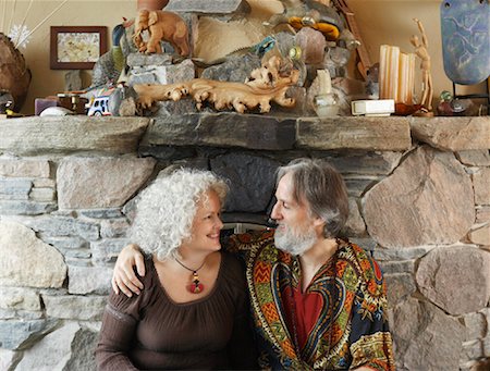 Hippie Couple in Front of Fireplace Stock Photo - Premium Royalty-Free, Code: 600-01083681