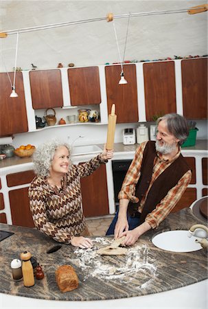 simsearch:649-06845217,k - Woman Teasing Man with Rolling Pin in Kitchen Stock Photo - Premium Royalty-Free, Code: 600-01083697