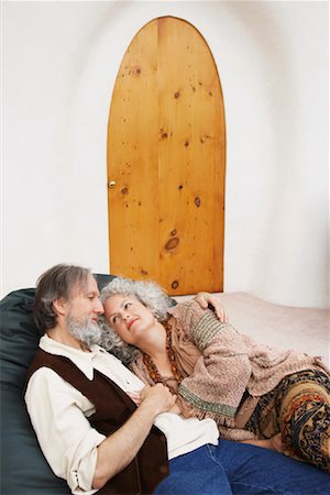 simsearch:600-01110389,k - Couple Cuddling in Chair Stock Photo - Premium Royalty-Free, Code: 600-01083724