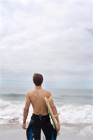 simsearch:400-03992760,k - Man Holding Surfboard Stock Photo - Premium Royalty-Free, Code: 600-01099696