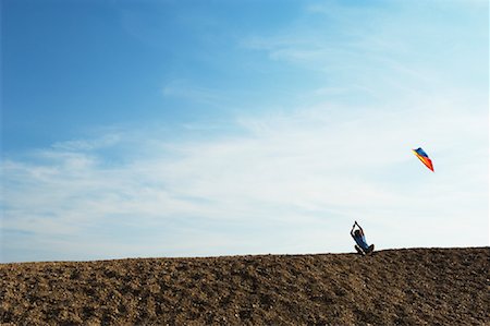 Boy Flying Kite Stock Photo - Premium Royalty-Free, Code: 600-01109688