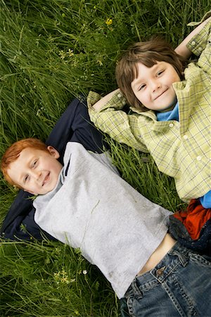 simsearch:600-01100083,k - Portrait of Boys Lying Down in Field of Grass Stock Photo - Premium Royalty-Free, Code: 600-01100019
