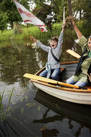 simsearch:600-01100083,k - Boys in Rowboat Pretending to be Pirates Stock Photo - Premium Royalty-Free, Code: 600-01100025