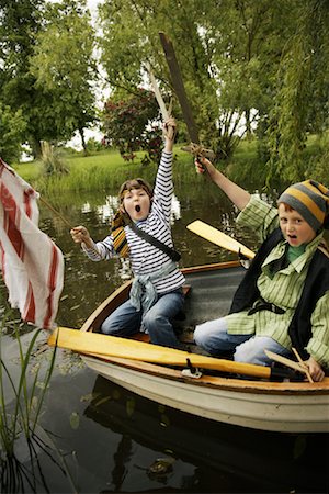 simsearch:600-01100083,k - Boys in Rowboat Pretending to be Pirates Stock Photo - Premium Royalty-Free, Code: 600-01100026