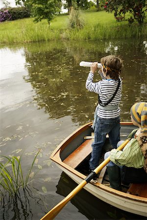 simsearch:600-05524087,k - Boys in Rowboat Pretending to be Pirates Foto de stock - Sin royalties Premium, Código: 600-01100029