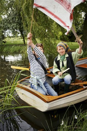 simsearch:600-01100083,k - Boys in Rowboat Pretending to be Pirates Stock Photo - Premium Royalty-Free, Code: 600-01100022