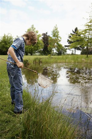 Boy Fishing in Pond Stock Photo - Premium Royalty-Free, Code: 600-01100037