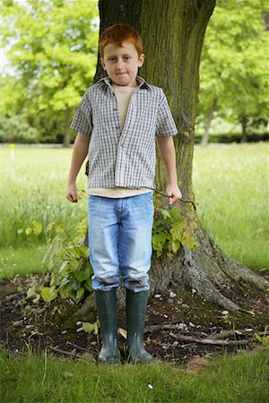 simsearch:600-01100083,k - Boy Standing in Front of Tree Stock Photo - Premium Royalty-Free, Code: 600-01100038