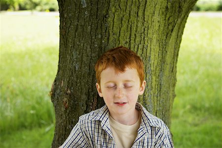 simsearch:600-01100083,k - Boy Standing in Front of Tree Stock Photo - Premium Royalty-Free, Code: 600-01100039