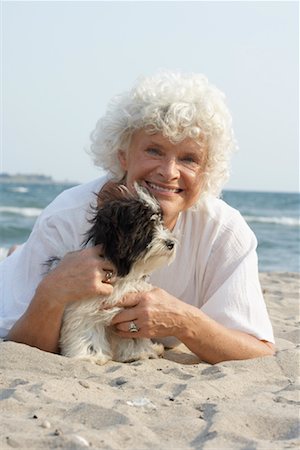 Woman with Dog on Beach Stock Photo - Premium Royalty-Free, Code: 600-01119935