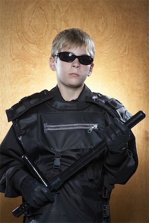 security costume - Boy Dressed as Policeman Stock Photo - Premium Royalty-Free, Code: 600-01119944